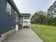 The exterior of the home features a screened-in back porch and a concrete patio at 4167 Old Stage N Rd # 4, Angier, NC 27501