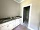 Bathroom vanity with double sinks, granite countertop, and access to the walk in closet at 4167 Old Stage N Rd # 4, Angier, NC 27501