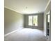 Bedroom with crown molding, double windows, and access to the bathroom at 4167 Old Stage N Rd # 4, Angier, NC 27501