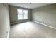 Bright bedroom featuring natural light from two large windows at 4167 Old Stage N Rd # 4, Angier, NC 27501