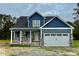 Charming two-story home boasting a two-car garage and stone accents in a well landscaped community at 4167 Old Stage N Rd # 4, Angier, NC 27501