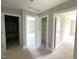 Hallway with multiple doorways, including a linen closet, leading to various rooms at 4167 Old Stage N Rd # 4, Angier, NC 27501