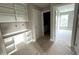 Hallway with built-in shelving and a view into the bathroom and bedroom area at 4167 Old Stage N Rd # 4, Angier, NC 27501