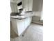 New kitchen island with granite countertops and white cabinets, ready for appliances at 4167 Old Stage N Rd # 4, Angier, NC 27501