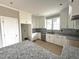 The new kitchen includes stainless appliances, granite countertops, and ample storage at 4167 Old Stage N Rd # 4, Angier, NC 27501