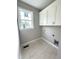 Laundry room with white cabinets and large window at 4167 Old Stage N Rd # 4, Angier, NC 27501