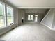 Spacious living room with a fireplace and stairs leading to the second floor at 4167 Old Stage N Rd # 4, Angier, NC 27501