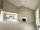 Spacious living room with fireplace open to the kitchen with white cabinets at 4167 Old Stage N Rd # 4, Angier, NC 27501