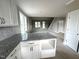 Bright, spacious living room with many windows adjacent to the brand-new kitchen at 4167 Old Stage N Rd # 4, Angier, NC 27501