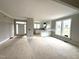 Open-concept living space with abundant natural light, leading into the kitchen area at 4167 Old Stage N Rd # 4, Angier, NC 27501