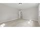 Neutral bedroom featuring new flooring, a closet, and a view of the hallway at 4307 Pope Rd, Durham, NC 27707