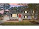 Charming two-story home featuring a bright red front door and well-maintained landscaping at 4307 Pope Rd, Durham, NC 27707