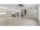 Bright open-concept living room and kitchen area with hardwood floors and modern lighting at 4307 Pope Rd, Durham, NC 27707