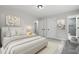Serene primary bedroom featuring a plush bed, soft lighting, neutral tones, and ample closet space, creating a relaxing retreat at 4307 Pope Rd, Durham, NC 27707