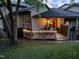 Inviting back deck with outdoor seating and charming string lights, perfect for evening relaxation at 4802 Glenmist Ct, Raleigh, NC 27612