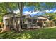 Exterior shot of a backyard featuring lush greenery, a spacious deck, and an inviting outdoor space at 4802 Glenmist Ct, Raleigh, NC 27612
