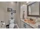 Stylish half-bathroom with a decorative mirror, copper sink and granite countertop at 4802 Glenmist Ct, Raleigh, NC 27612