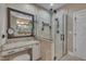 Updated bathroom with granite vanity and a glass enclosed tile shower at 4802 Glenmist Ct, Raleigh, NC 27612
