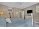 Comfortable bedroom features soft blue bedding, white dressers, and an ensuite bathroom and walk-in closet at 4802 Glenmist Ct, Raleigh, NC 27612