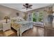 Serene bedroom with hardwood floors, natural light, and calm color scheme at 4802 Glenmist Ct, Raleigh, NC 27612