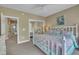 Bright bedroom with large windows and a mirrored closet at 4802 Glenmist Ct, Raleigh, NC 27612