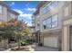 Charming exterior of a townhome with stone accents, attached garage, tree in the yard, and well-maintained landscaping at 4802 Glenmist Ct, Raleigh, NC 27612
