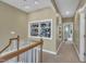 Second floor hallway features display shelves, neutral carpeting, and natural light at 4802 Glenmist Ct, Raleigh, NC 27612
