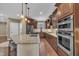 Spacious kitchen boasting stainless steel appliances, granite countertops, and custom cabinetry at 4802 Glenmist Ct, Raleigh, NC 27612