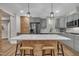 Beautiful kitchen featuring grey cabinets, stainless steel appliances, and a large island with seating at 4802 Glenmist Ct, Raleigh, NC 27612