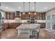 Stunning kitchen featuring a large island, modern appliances, and rich wood cabinetry at 4802 Glenmist Ct, Raleigh, NC 27612