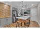 Stylish kitchen with wood accents, stainless steel appliances, and an island with seating at 4802 Glenmist Ct, Raleigh, NC 27612