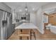 Kitchen with quartz countertops, stainless steel appliances, and island with seating at 4802 Glenmist Ct, Raleigh, NC 27612