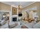 Bright living room with stone fireplace and plush seating arrangement at 4802 Glenmist Ct, Raleigh, NC 27612