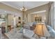 Beautiful living area with lots of seating and large windows providing ample natural light at 4802 Glenmist Ct, Raleigh, NC 27612