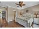 Comfortable main bedroom with paneled accent wall and leaf ceiling fan at 4802 Glenmist Ct, Raleigh, NC 27612