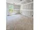 A bright unfinished bedroom with a window, awaiting personal touches to create a cozy sanctuary at 50 Moonraker Dr, Spring Hope, NC 27882