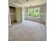 Unfinished bedroom filled with natural light streaming through the window, awaiting your personal touch at 50 Moonraker Dr, Spring Hope, NC 27882