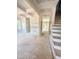 Unfinished living room boasts coffered ceilings, wainscoting, and a view of the staircase at 50 Moonraker Dr, Spring Hope, NC 27882
