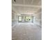 Spacious unfinished main bedroom with tray ceiling and large windows for ample natural light at 50 Moonraker Dr, Spring Hope, NC 27882
