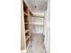 Unfinished walk-in closet with built-in shelving and hanging rods awaiting personalization at 50 Moonraker Dr, Spring Hope, NC 27882