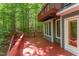 Large outdoor decks with stairs offers an excellent space for entertaining with wooded views at 5314 Taproot Ln, Durham, NC 27705