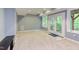 Spacious finished basement with a walkout to the yard, recessed lighting, and neutral carpeting at 5314 Taproot Ln, Durham, NC 27705