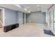 Finished basement featuring a built-in shelving unit, recessed lighting, and neutral carpeting at 5314 Taproot Ln, Durham, NC 27705