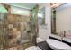 Bathroom features a modern sink, glass shower, and beautiful tile work at 5314 Taproot Ln, Durham, NC 27705