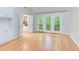 Bedroom featuring wood floors and access to the deck and an ensuite bathroom at 5314 Taproot Ln, Durham, NC 27705
