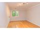 Bright bedroom with hardwood floors, a window and a closet for a cozy space at 5314 Taproot Ln, Durham, NC 27705