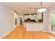Open-concept kitchen with white cabinetry, granite countertops and stainless steel appliances at 5314 Taproot Ln, Durham, NC 27705