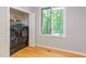 Bright laundry room with a large window, modern appliances, and ample storage space at 5314 Taproot Ln, Durham, NC 27705