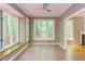 Bright sun room with tile floors, large windows with natural light and an outdoor view at 5314 Taproot Ln, Durham, NC 27705