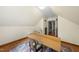 Converted attic area showing wood floors, neutral walls, and adaptable interior for various uses at 5513 Doemont Dr, Apex, NC 27539